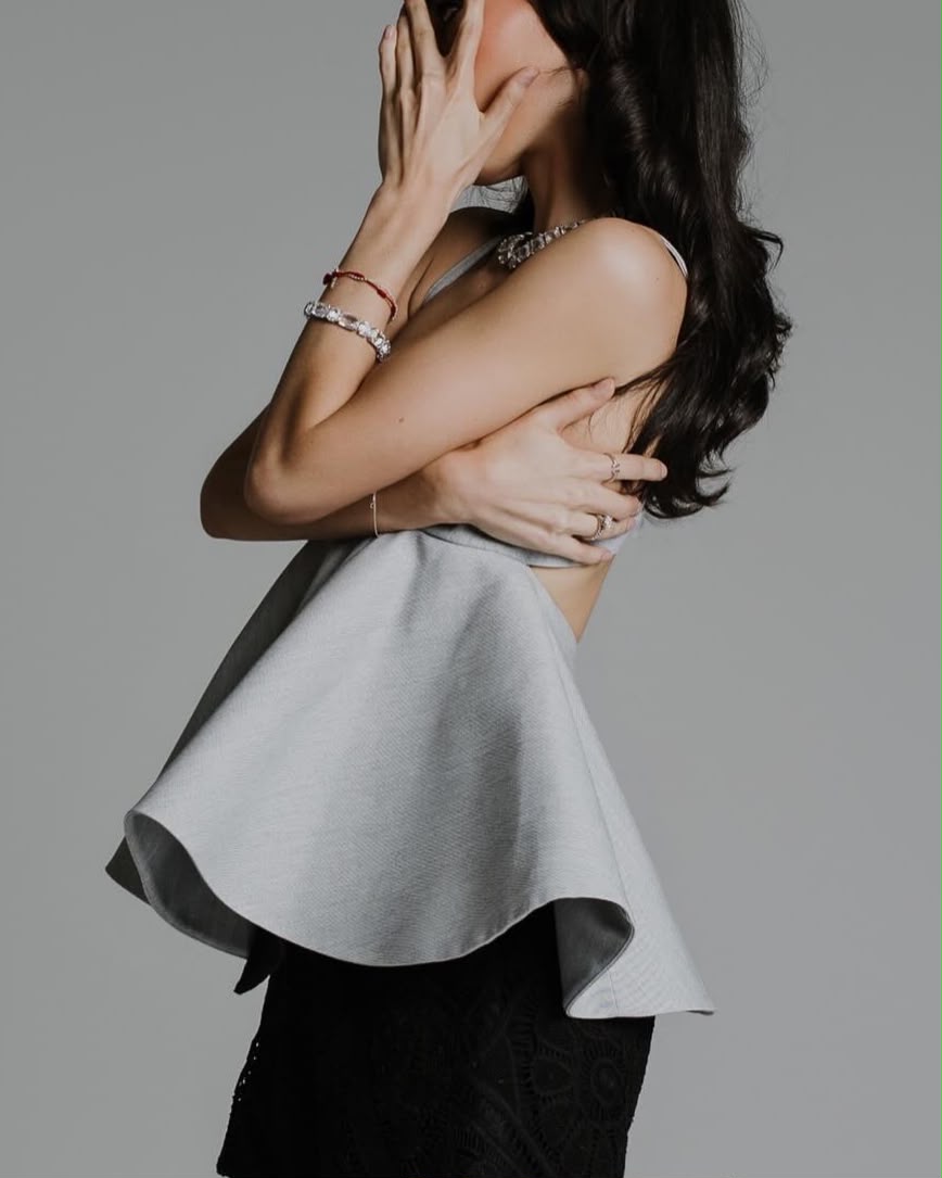 Vela Peplum Top